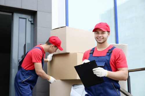 Moving van and packed boxes representing a removals booking