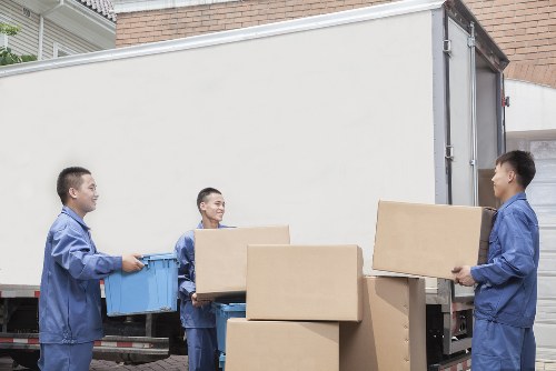 Local team collecting bulky furniture from a flat