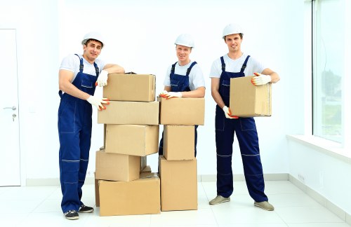Packed boxes and furniture being loaded for a local removal job