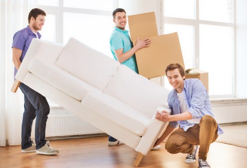 Packing and loading household items into a removals van