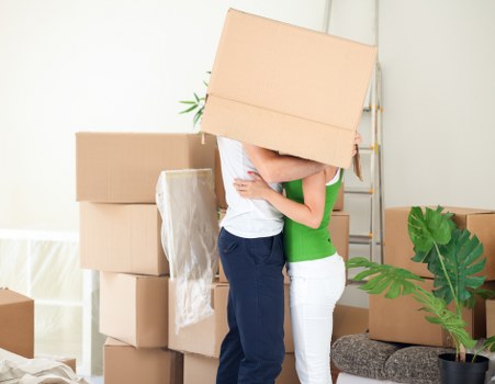 Packed boxes and furniture ready for a move in Merton