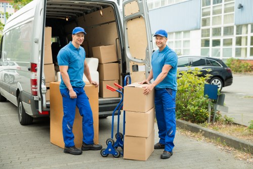 Careful wrapping of fragile household items during a Merton move
