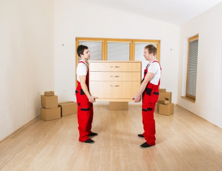 Loading furniture into a van for a house move in Merton