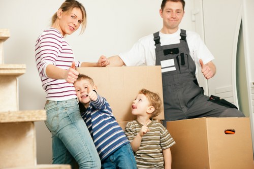 Professional removals crew applying safety procedures on site